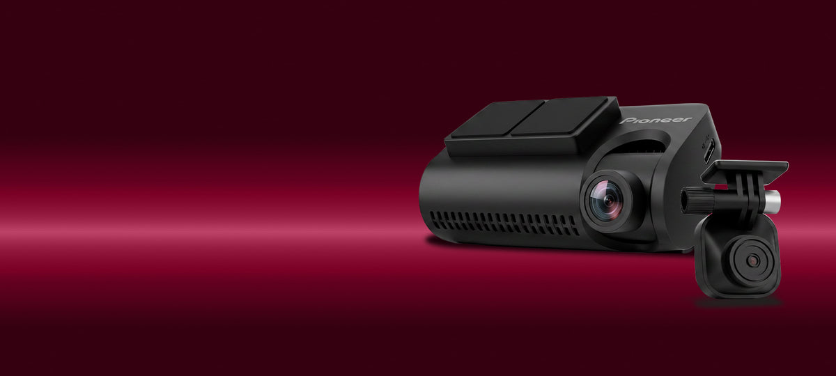 A black Pioneer dash cam with a rear backup camera module, shown on a dark red gradient background.