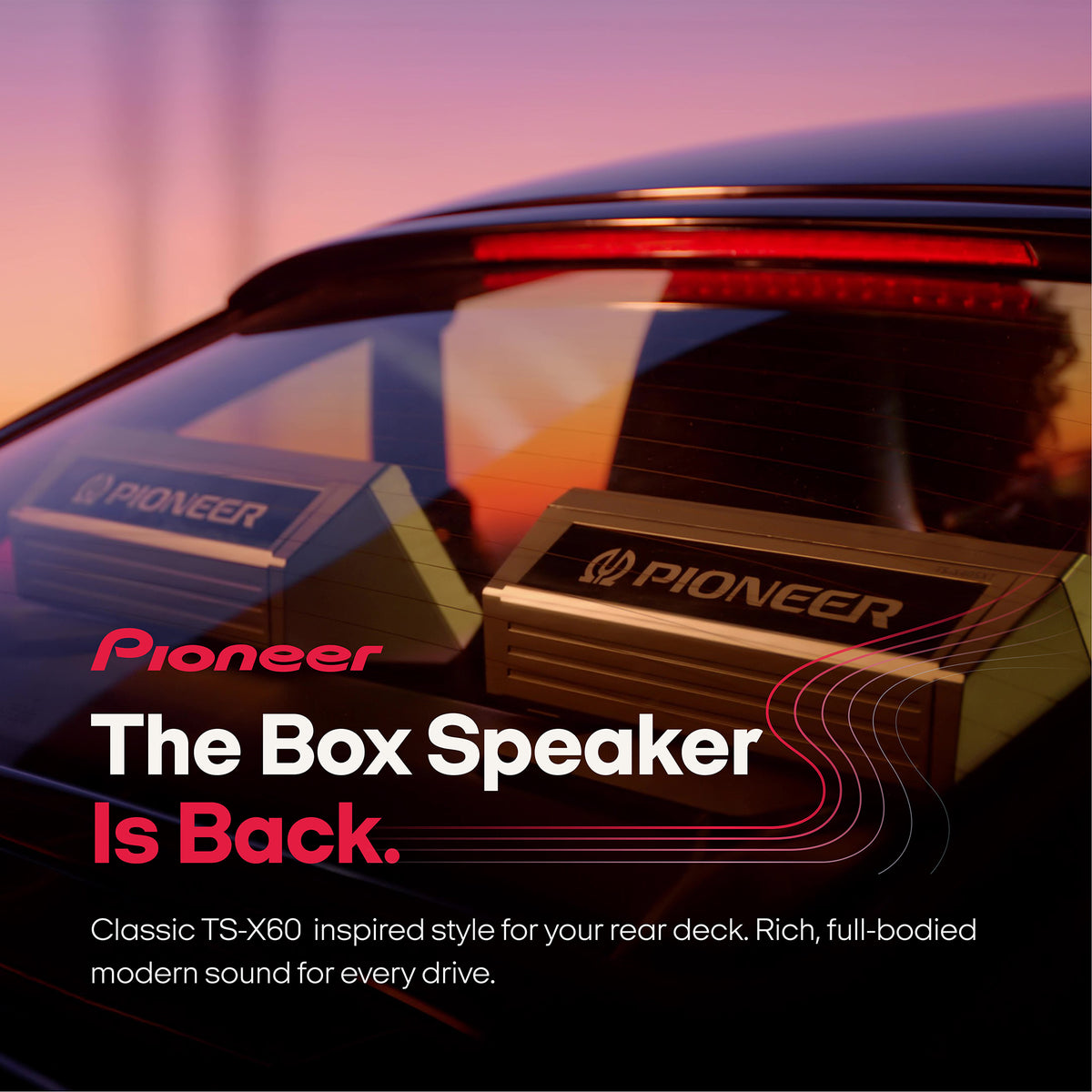 Pioneer rear deck box speaker shown installed on a car window, with promotional text reading 'The Box Speaker Is Back.' and a sunset-colored background.
