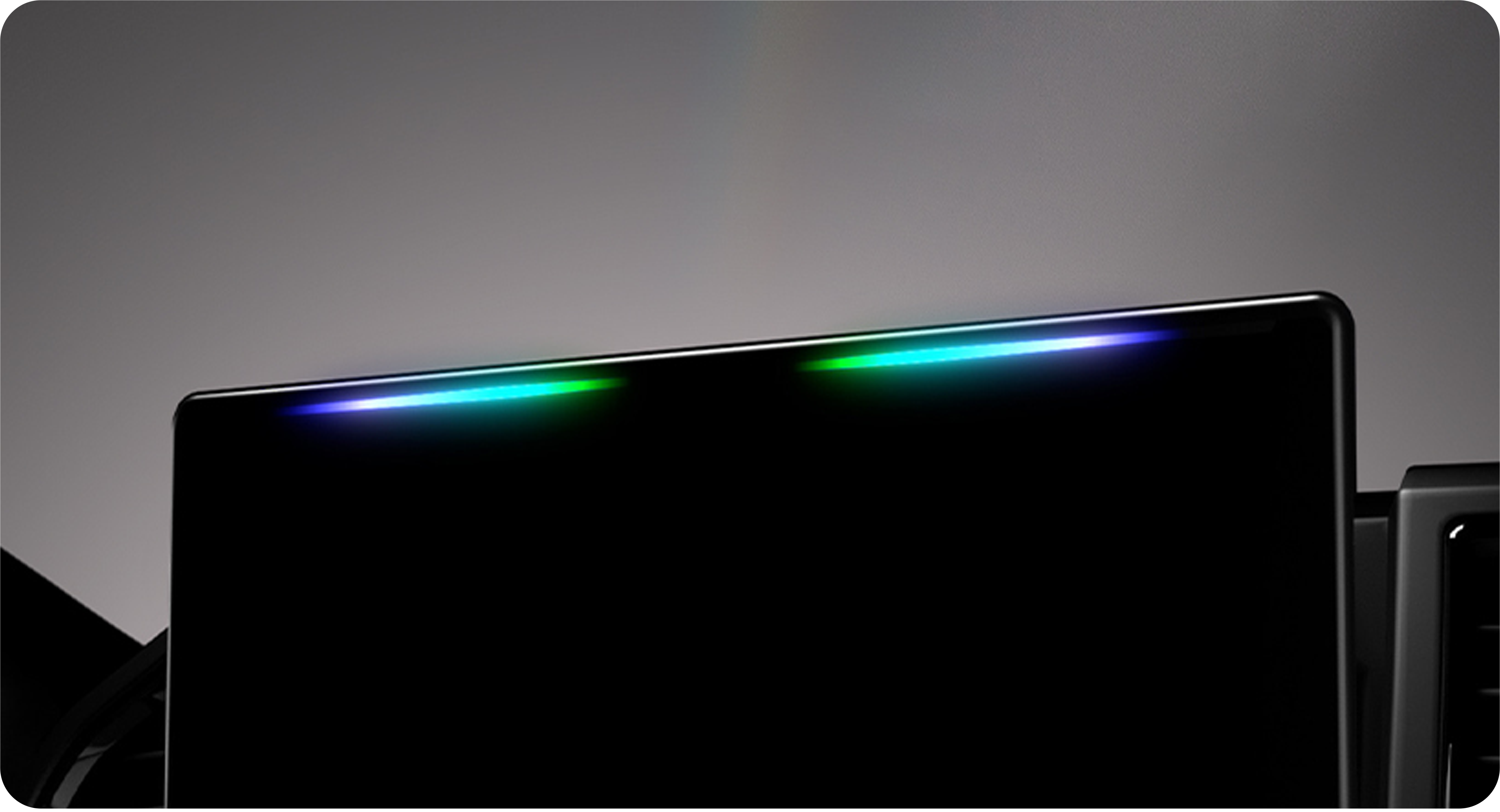 Black electronic device with colorful lighting on a dark background