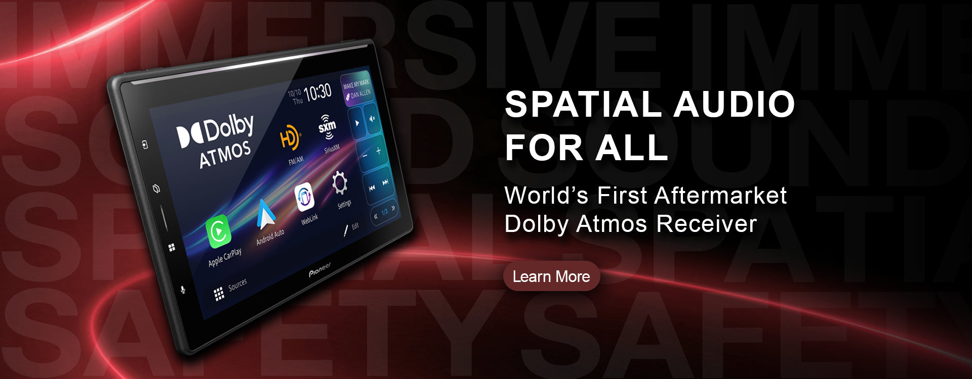 Aftermarket Dolby Atmos receiver with digital display on a dark background
