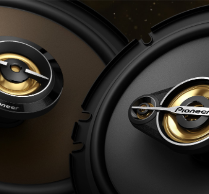 Close-up of Pioneer car speakers with gold accents