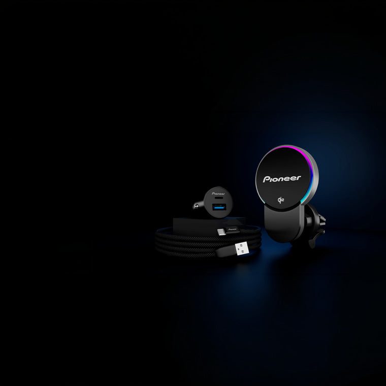Pioneer car dashboard kit with air vent mount, USB cable, and car charger on a dark background