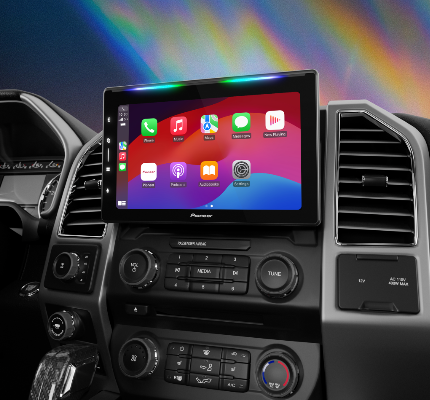 Car dashboard with a Pioneer car multimedia system displaying app icons.
